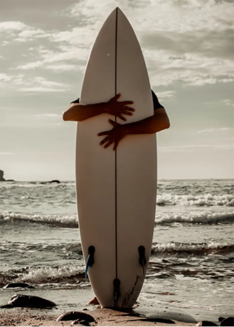 A man behind a surf board